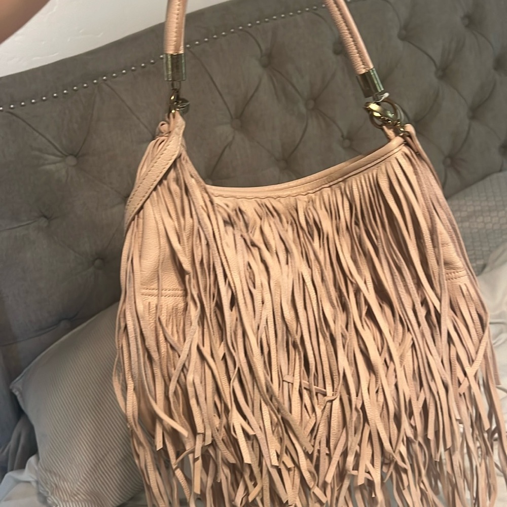 H&M purse with frills and boho style. Worn only few times. Great condition.
